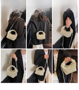 Detailed views of a handmade white pearl beaded handbag with a round top handle