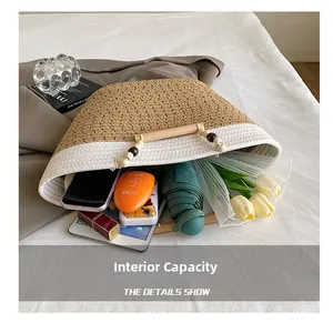 Detail of woven tote bag interior showing large capacity for essentials like sunblock and umbrella