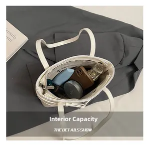 Top view of cream-white bucket bag interior showing large capacity for daily items