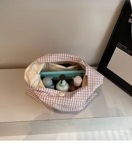 Spacious interior of plaid tote bag showing large capacity for tablet and accessories
