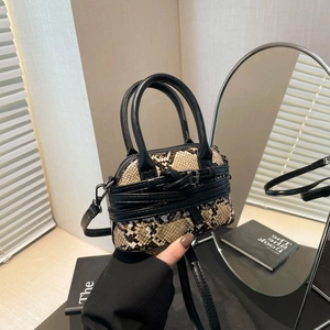 Mini faux snake skin crossbody bag with black handles and metal buckle detail