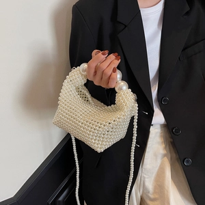 Handmade woven pearl handbag with large bead handle and crossbody chain for evening events