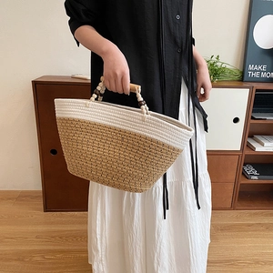 French woven tote bag with wooden bead handle and straw patchwork for summer vacation