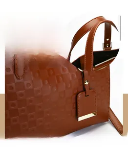 Detail of dark brown embossed checkered bag showing precise stitching and gold metal hardware