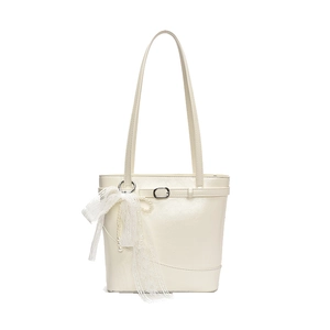 Minimalist creamy white leather bucket bag with pearl strap and lace bow decoration