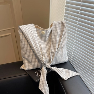 Checkered canvas tote bag with bow knot strap and button closure for daily use