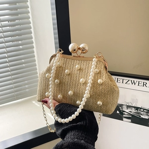 Elegant beige woven evening bag with pearl embellishments and gold chain strap