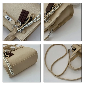 Detail of beige litchi grain texture, silver clasp, and chocolate charm on women's handbag