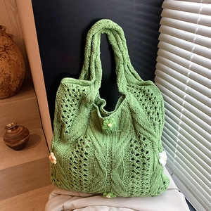 Green woven tote bag with 3D floral accents and openwork knit texture for women