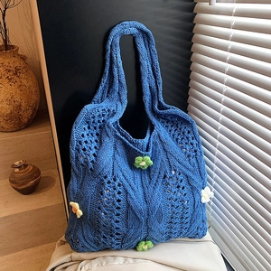 Klein blue hollow knit tote bag with handmade 3D floral accents and dual shoulder straps