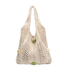 Cream white hand-crocheted tote bag with 3D floral accents and diamond knit pattern