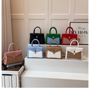 Detailed grid of faux crocodile texture handbags in seven assorted color combinations