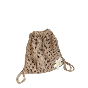Beige hollow knit crossbody bag with drawstring closure and white daisy flower details