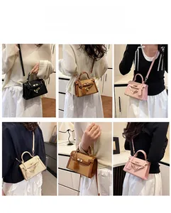 Detailed views of versatile stitched leather handbag worn as shoulder and crossbody bag