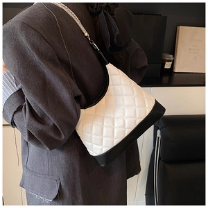 Quilted hobo bag with black and white color blocking and pearl chain detail