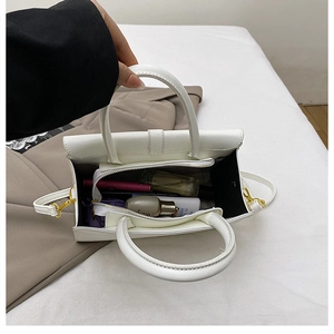 Internal view of the large capacity white crocodile pattern handbag with cosmetics