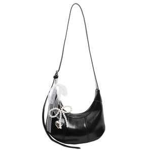 Black crescent bag with glossy finish and decorative pearl mesh bow charms