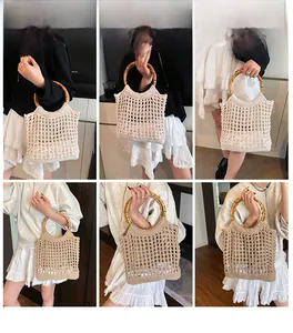 Detail view of hollow knit beach bag with round bamboo handles and mesh weave texture