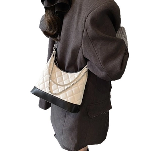 Quilted hobo bag in black and white leather with silver double chain shoulder strap