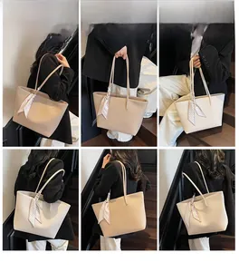 Detailed views of a beige lychee pattern tote bag with scarf detail worn by a model