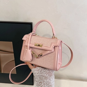 Pink woven straw Kelly style handbag with leather trim and gold twist lock closure