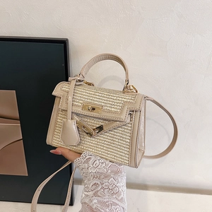 Straw and leather patchwork Kelly style bag with golden buckle and crossbody strap