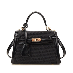 Chic black patchwork Kelly handbag with leather and woven texture and gold lock hardware
