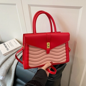 Red and pink dual-tone faux leather handbag with wave quilting and gold lock