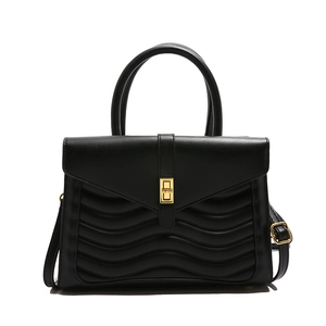 Black crocodile pattern handbag with gold clasp and elegant wave-quilted details