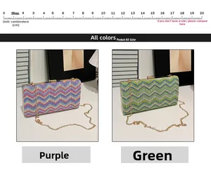 Detail of woven evening clutch in purple and green with gold frame and chain strap
