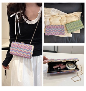 Detailed interior view of a wave-patterned woven evening bag showing storage capacity