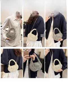 Detail of handmade pearl and silver beaded bag showing crossbody chain and woven texture