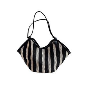Striped mesh tote bag with black and white vertical patterns and leather straps