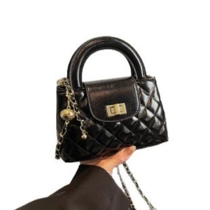 Fashionable black quilted mini handbag with gold chain strap and top handle for women