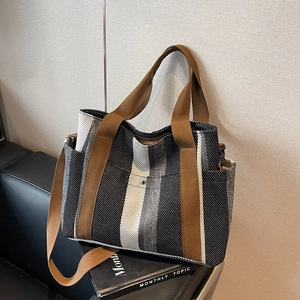 Large capacity tote bag with vertical stripes and adjustable brown shoulder strap