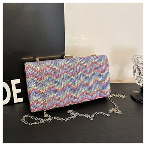 Chic multi-color chevron woven bag with gold chain and frame for party wear