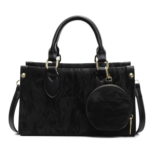 Minimalist black tote bag with textured surface, gold hardware and mini round pouch