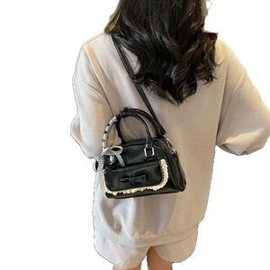 Trendy black PU crossbody bag with white lace trim and bow knot detail for women