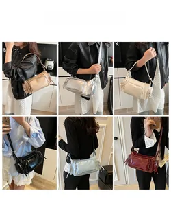 Detail showing various colors of shiny PU leather motorcycle bags with multi-pocket design