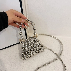 Unique silver beaded triangle handbag with top handle and crossbody chain strap