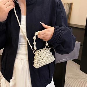 Handmade woven pearl crossbody bag with beaded handle and elegant gold-tone metal hardware