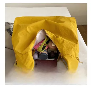 Internal view of the large ginger yellow tote bag showing spacious storage capacity