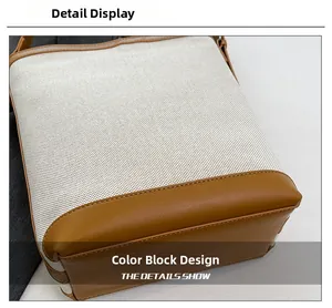Detail view of canvas bucket bag showing color-blocking design and precision stitching