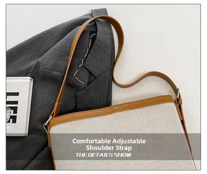 Detail of adjustable shoulder strap with silver buckle on canvas and leather bucket bag