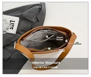 Detailed view of bucket bag interior showing main pocket, zipper pocket and phone slot