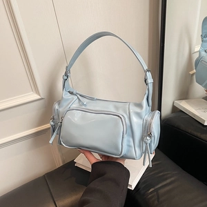 Retro light blue hobo shoulder bag with multiple zippers and silver hardware