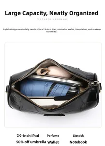 Interior view of black pebbled leather crossbody bag showing space for a 7.9-inch iPad