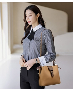Lychee texture bucket bag in brown leather styled with business casual striped shirt