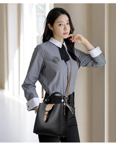 Detail of lychee pattern bucket bag with woven handle, contrast buckle and silk scarf