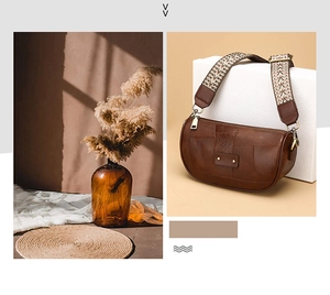 Detail of a brown crescent leather bag featuring a retro geometric woven wide strap